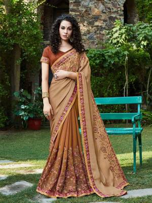 Rich And Elegant Looking Designer Saree Is Here In Beige And Brown Color Paired With Brown Colored Blouse. This Saree Is Fabricated On Satin And Georgette Paired With Art Silk Fabricated Blouse. Buy Now.
