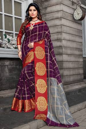 Celebrate This Festive Season Wearing This Saree In Wine Color Paired With Contrasting Red Colored Blouse. This Saree And Blouse Are Cotton Silk Beautified With Weave and Prints. Buy Now.