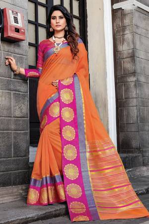 Celebrate This Festive Season Wearing This Saree In Orange Color Paired With Contrasting Rani Pink Colored Blouse. This Saree And Blouse Are Cotton Silk Beautified With Weave and Prints. Buy Now.