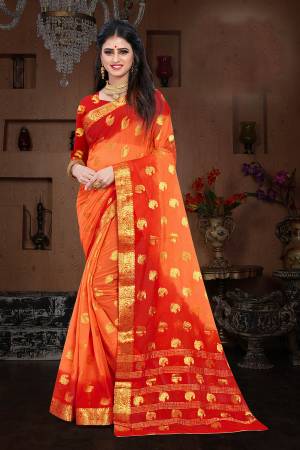 Here Is A Pretty Shaded Saree In Orange And Red Color. This Saree Is Fabricated On Chiffon Paired With Art Silk Fabricated Blouse. It Is Beautified With Attractive Weave All Over. 
