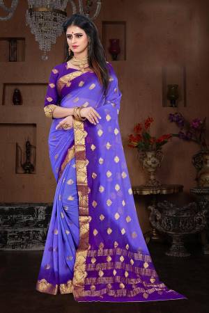 Here Is A Pretty Shaded Saree In Blue And Violet Color. This Saree Is Fabricated On Chiffon Paired With Art Silk Fabricated Blouse. It Is Beautified With Attractive Weave All Over. 