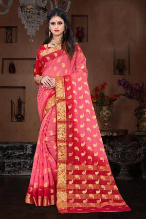 Here Is A Pretty Shaded Saree In Pink And Red Color. This Saree Is Fabricated On Chiffon Paired With Art Silk Fabricated Blouse. It Is Beautified With Attractive Weave All Over. 