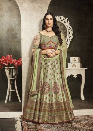 Grab This Beautiful Designer Two In One Lehenga Choli Cum Gown In?Mint Green Color. You Can Get This Stitched As A Lehenga Or Floor Length Gown As Per Your Occasion And Convenience. Its Blouse Are Lehenga Are Fabricated On Soft Silk Beautified With Digital Prints And Embroidery Paired With Chiffon Fabricated Dupatta. Buy This Heavy Designer Piece Now