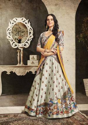 Grab This Beautiful Designer Two In One Lehenga Choli Cum Gown In?Grey And Yellow Color. You Can Get This Stitched As A Lehenga Or Floor Length Gown As Per Your Occasion And Convenience. Its Blouse Are Lehenga Are Fabricated On Soft Silk Beautified With Digital Prints And Embroidery Paired With Chiffon Fabricated Dupatta. Buy This Heavy Designer Piece Now