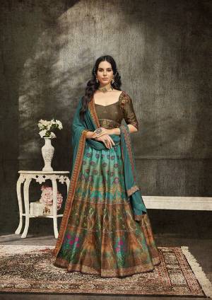 Grab This Beautiful Designer Two In One Lehenga Choli Cum Gown In?Blue And Brown Color. You Can Get This Stitched As A Lehenga Or Floor Length Gown As Per Your Occasion And Convenience. Its Blouse Are Lehenga Are Fabricated On Soft Silk Beautified With Digital Prints And Embroidery Paired With Chiffon Fabricated Dupatta. Buy This Heavy Designer Piece Now