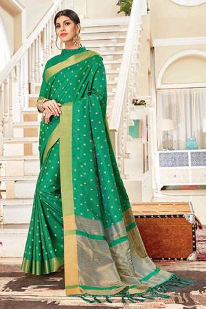 Celebrate This Festive Season With Beauty And Comfort In This Silk Based Saree In Green Color. This Saree Is Light In Weight And Easy To Carry All Day Long, Also Its Rich Fabric And Color Will Earn you Lots Of Compliments From Onlookers.