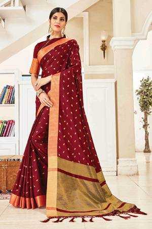 Enhance Your Personality Wearing This Elegant And Rich Looking Saree In Maroon Color. This Saree And Blouse Are Fabricated On Art Silk Which Gives A Rich Look To Your Personality. 