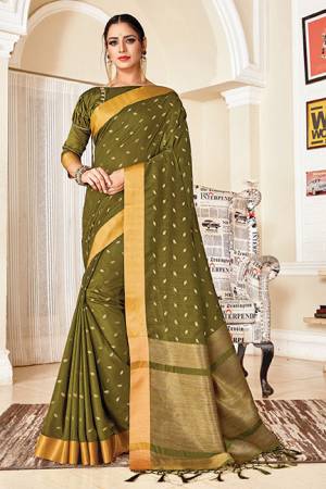 Celebrate This Festive Season With Beauty And Comfort In This Silk Based Saree In Olive Green Color. This Saree Is Light In Weight And Easy To Carry All Day Long, Also Its Rich Fabric And Color Will Earn you Lots Of Compliments From Onlookers.