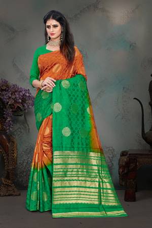 Shine Bright Wearing This Designer Saree In Rust Orange And Green Color Paired With Green Colored Blouse. This Saree And Blouse Are Fabricated Art Silk Beautified With Weave All Over. Buy Now.