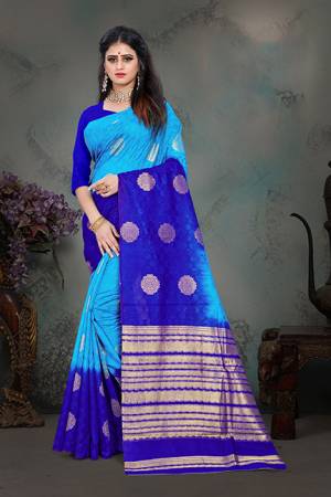 Shine Bright Wearing This Designer Saree In Blue & Royal Blue Color Paired With Royal Blue Colored Blouse. This Saree And Blouse Are Fabricated Art Silk Beautified With Weave All Over. Buy Now.