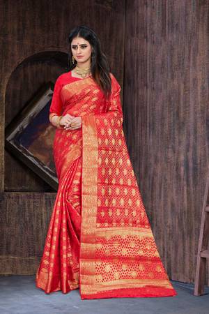 Celebrate This Festive Season Wearing This Saree In Red Color?Paired With Red Colored Blouse. This Saree And Blouse Are Art Silk Based Beautified With Weave