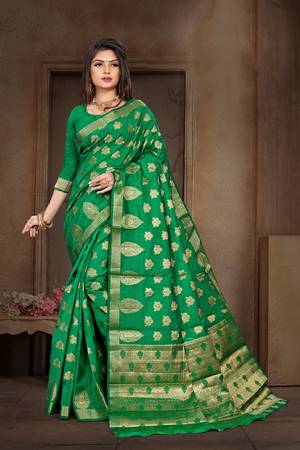 For A Proper Traditional Look, Grab This Lovely Saree In Green Color Paired With Green Colored Blouse. This Saree Is Fabricated On Art Silk Which Is Light Weight , Durable And Easy To Carry All Day Long.