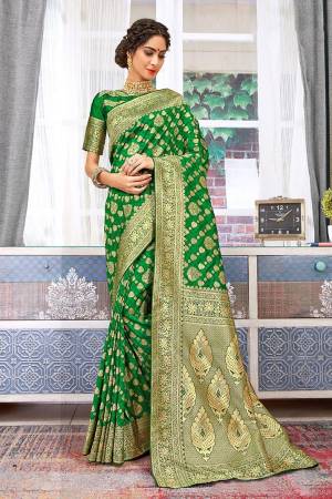 Celebrate This Festive Season Wearing This Designer Silk Based Saree In Green Color. This Saree And Blouse Are Fabricated Weaving Art Silk Beautified With Attractive Detailed Weave All Over. 