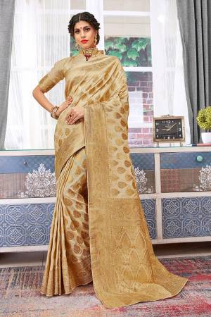 Flaunt Your Rich And Elegant Taste Wearing This Designer Saree In Beige Color Paired With Beige Colored Blouse, This Saree And Blouse Are Weaving Art Silk Based Which Also Gives A Rich Look To Your Personality. 