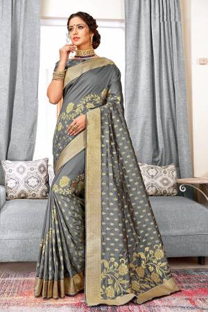 Flaunt Your Rich And Elegant Taste Wearing This Designer Saree In Dark Grey Color Paired With Dark Grey Colored Blouse, This Saree And Blouse Are Weaving Art Silk Based Which Also Gives A Rich Look To Your Personality. 