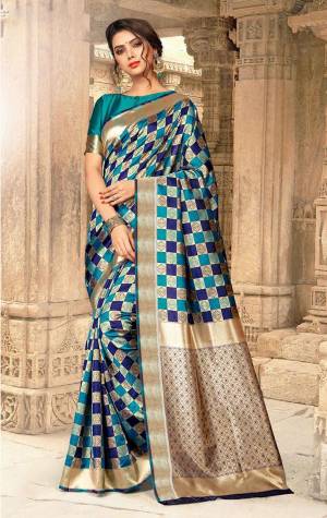 This Festive Season, Be The Most Attractive One Wearing This Checks Pattern Designer Saree In Blue And Navy Blue Color Paired With Blue Colored Blouse. This Saree And Blouse Are Fabricated On Art Silk Beautified With Weave All Over. Buy Now.