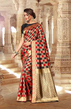 Here Is An Attractive Checkered Patterned Designer Silk Based Saree In Red And Black Color Paired With Red Colored Blouse. Its Attractive Pattern And Color Pallete Will Earn You Lots Of Compliments From Onlookers.