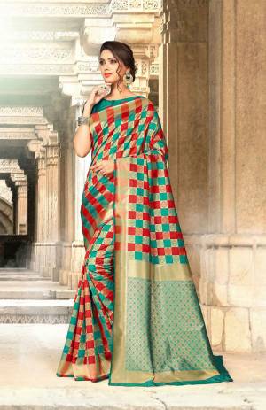 This Festive Season, Be The Most Attractive One Wearing This Checks Pattern Designer Saree In Sea Green And Red Color Paired With Sea Green Colored Blouse. This Saree And Blouse Are Fabricated On Art Silk Beautified With Weave All Over. Buy Now.