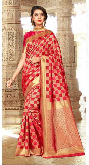 Here Is An Attractive Checkered Patterned Designer Silk Based Saree In Dark Pink And Red Color Paired With Dark Pink Colored Blouse. Its Attractive Pattern And Color Pallete Will Earn You Lots Of Compliments From Onlookers.