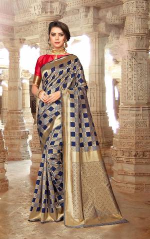 This Festive Season, Be The Most Attractive One Wearing This Checks Pattern Designer Saree In Navy Blue And Grey Color Paired With Dark Pink Colored Blouse. This Saree And Blouse Are Fabricated On Art Silk Beautified With Weave All Over. Buy Now.