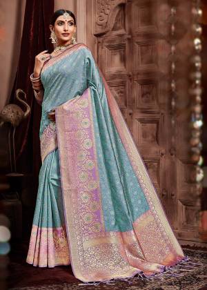 Flaunt Your Rich And Elegant Taste Wearing This Designer Silk Based Heavy Weaved Saree In Blue And Purple Color Paired With Purple Colored Blouse. Its Rich Fabric And Elegant Color will Give A Unique Look To Your Personality, Also Its Fabric Is Durable And Easy To Carry All Day Long. 