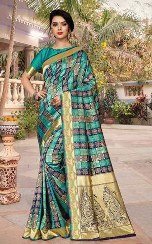 Go With The Pretty Blues With This Designer Checks Patterned Saree In Blue And Navy Blue Color Paired With Blue Colored Blouse. This Saree Is Jacquard Silk Based Paired With Art Silk Fabricated Blouse. 