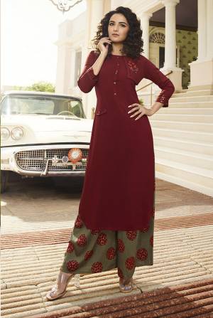 Enhance Your Personality Wearing This Elegant Readymade Kurti In Maroon Color Paired With Contrasting Olive Green Colored Plazzo. This Readymade Kurti And Plazzo Are Fabricated On Rayon Beautified With Prints And Resham Work. Buy Now.