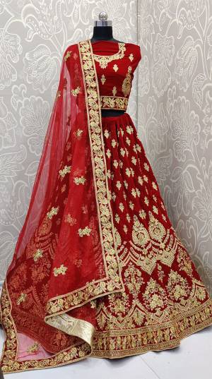 Get Ready For Your D-Day With This Very Beautiful And Heavy Designer Lehenga Choli In Red Color. This Heavy Embroidered Lehenga Choli Is Fabricated On Velvet Paired With Net Fabricated Dupatta. Its Rich Fabric And Heavy Detailed Embroidery Will Give An Attractive Look To Your Personality