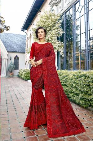 Add This very Beautiful Heavy Designer Saree To Your Wardrobe In Red Color Paired With Red Colored Blouse. This Heavy Embroidered Saree Is Georgette Based Paired With Art Silk Fabricated Blouse. Buy Now.