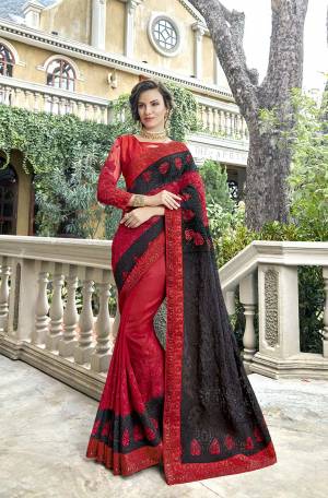 Add This very Beautiful Heavy Designer Saree To Your Wardrobe In Red And Black Color Paired With Red Colored Blouse. This Heavy Embroidered Saree Is Georgette Based Paired With Art Silk And Net Fabricated Blouse. Buy Now.
