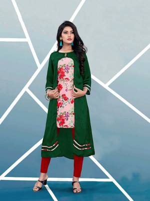 Add This Pretty Readymade Kurti In Dark Green And Multi Color Fabricated On Satin Beautified With Prints. It Is Light In Weight And Easy To Wear All Day Long. Buy Now.