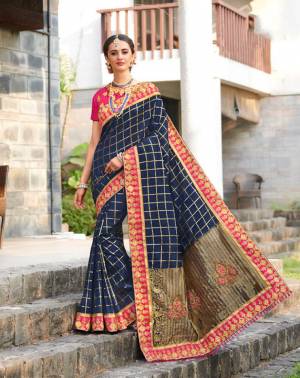Enhance Your Personality In This Heavy Designer Saree In Navy Blue Color Paired With Contrasting Rani Pink Colored Blouse. This Saree Is Fabricated On Jacquard Silk Paired With Art Silk Fabricated Blouse. Buy Now.