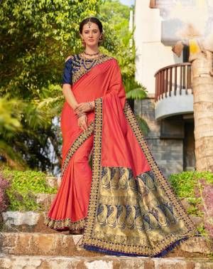 Celebrate This Festive Season Wearing This Heavy Designer Saree In Old Rose Pink Color Paired With Contrasting Navy Blue Colored Blouse. This Saree And Blouse are Silk Based Giving You A Proper Traditional Look. 