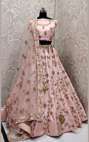 This Season Is About Subtle Shades And Pastel Play, So Grab This Very Beautiful Heavy Designer Lehenga Choli In Baby Pink Color. Its Heavy Embroidered Blouse And Lehenga Are Satin Silk Based Paired With net Fabricated Embroidered Dupatta. Buy This Pretty Piece Now.