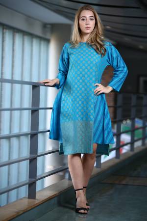 Here Is A Pretty Readymade Designer Tunic In Blue Color Fabricated On Khadi. You can Pair This Up With Any Kind Of Bottoms Or Else You can Wear It Is. Buy Now.