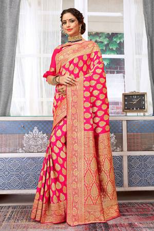Shine Bright Wearing This Designer Saree In Fuschia Pink Color Paired With Fuschia Pink Colored Blouse. This Saree And Blouse Are Fabricated On Weaving Art Silk Beautified With Weave All Over. Buy Now