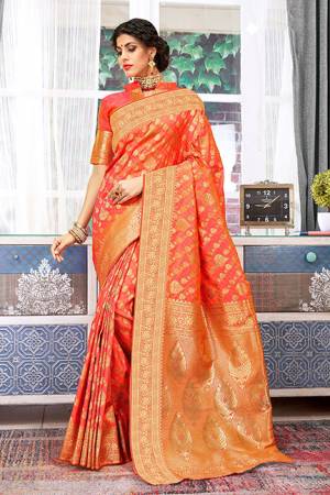Celebrate This Festive Season Wearing This Designer Silk Based Saree In Orange Color. This Saree And Blouse Are Fabricated Weaving Art Silk Beautified With Attractive Detailed Weave All Over.
