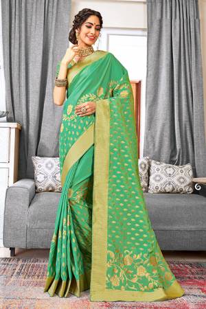 Look Beautiful Wearing This Designer Saree In Light Green Color Paired With Fuschia Pink Colored Blouse. This Saree And Blouse Are Fabricated On Weaving Art Silk Beautified With Weave All Over. Buy Now