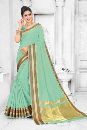 Grab This Pretty Elegant Looking Saree In Sea Green Color. This Saree Is Fabricated On Soft Cotton Paired With Art Silk Fabricated Blouse. It Is Beautified With Checks Foil Print And Lace Border. Also It Is Light In Weight And Easy To Carry All Day Long. 