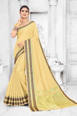 Grab This Pretty Elegant Looking Saree In Light Yellow Color. This Saree Is Fabricated On Soft Cotton Paired With Art Silk Fabricated Blouse. It Is Beautified With Checks Foil Print And Lace Border. Also It Is Light In Weight And Easy To Carry All Day Long. 