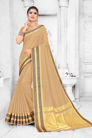 Grab This Pretty Elegant Looking Saree In Beige Color. This Saree Is Fabricated On Soft Cotton Paired With Art Silk Fabricated Blouse. It Is Beautified With Checks Foil Print And Lace Border. Also It Is Light In Weight And Easy To Carry All Day Long. 