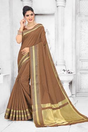 Grab This Pretty Elegant Looking Saree In Brown Color. This Saree Is Fabricated On Soft Cotton Paired With Art Silk Fabricated Blouse. It Is Beautified With Checks Foil Print And Lace Border. Also It Is Light In Weight And Easy To Carry All Day Long. 