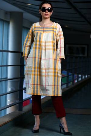 Here Is A Pretty Checks Printed Readymade Kurti In White And Yellow Color Paired With Maroon Colored Bottom. This Kurti Is cotton Based Paired With Khadi Fabricated Bottom. 