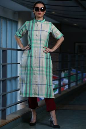 Here Is A Pretty Checks Printed Readymade Kurti In White And Sea Green Color Paired With Maroon Colored Bottom. This Kurti Is cotton Based Paired With Khadi Fabricated Bottom. 