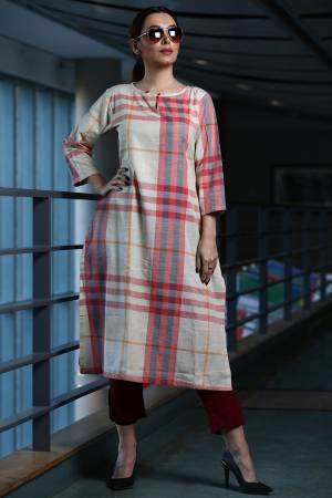 Here Is A Pretty Checks Printed Readymade Kurti In White And Pink Color Paired With Maroon Colored Bottom. This Kurti Is cotton Based Paired With Khadi Fabricated Bottom. 
