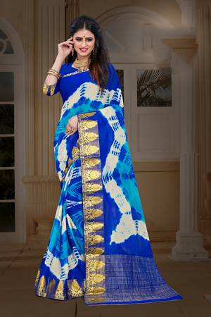 New And Unique Patterned Bandhani Printed Designer Saree In Blue color Paired With Royal Blue colored Blouse. This Saree Is Fabricated On Chiffon Paired With Art Silk Fabricated Blouse. It Is Light In Weight And Easy To Carry All Day Long. 