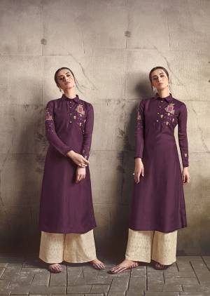 Add This Very Beautiful Designer Readymade Pair Of Kurti And Plazzo To Your Wardrobe In Wine Colored Kurti Paired With Cream Colored Plazzo. This Pretty Embroidered Kurti Is Fabricated On Soft Art Silk Paired With Cotton Fabricated Tone To Tone Embroidered Bottom. 
