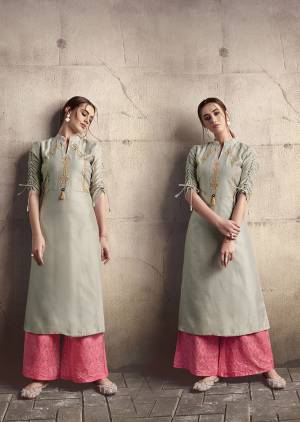 Flaunt Your Rich And Elegant Taste Wearing This Designer Readymade Kurti In Grey Color Paired With Pink Colored Plazzo. This Kurti Is Silk Based Beautified With Thread Work Paired With Cotton Fabricated Bottom Beautified With Tone To Tone Thread Work. 
