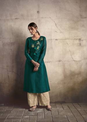 Add This Very Beautiful Designer Readymade Pair Of Kurti And Plazzo To Your Wardrobe In Teal Blue Colored Kurti Paired With Cream Colored Plazzo. This Pretty Embroidered Kurti Is Fabricated On Soft Art Silk Paired With Cotton Fabricated Tone To Tone Embroidered Bottom. 