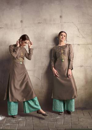 For A Bold And Beautiful Look, Grab This Designer Readymade Kurti In Brown Color Paired With Sea Green Colored Readymade Plazzo. This Pretty Kurti Is Silk Based Paired With Cotton Fabricated Bottom. 